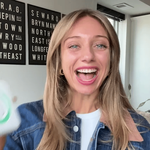 A single green leaf against a white background.